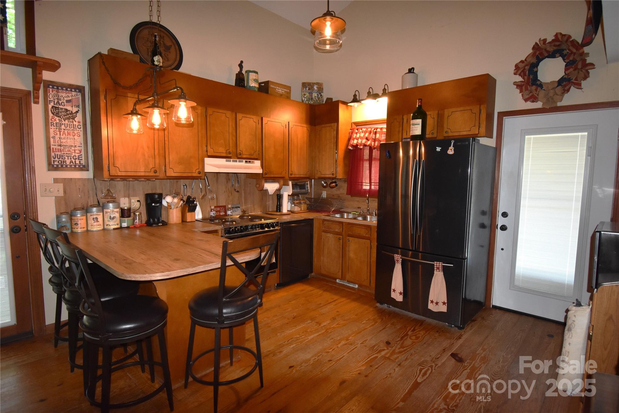 5769 Birch Street Conover, NC 28613 - Photo 15 of 45 a kitchen with stainless steel appliances granite countertop a refrigerator a sink a stove and island