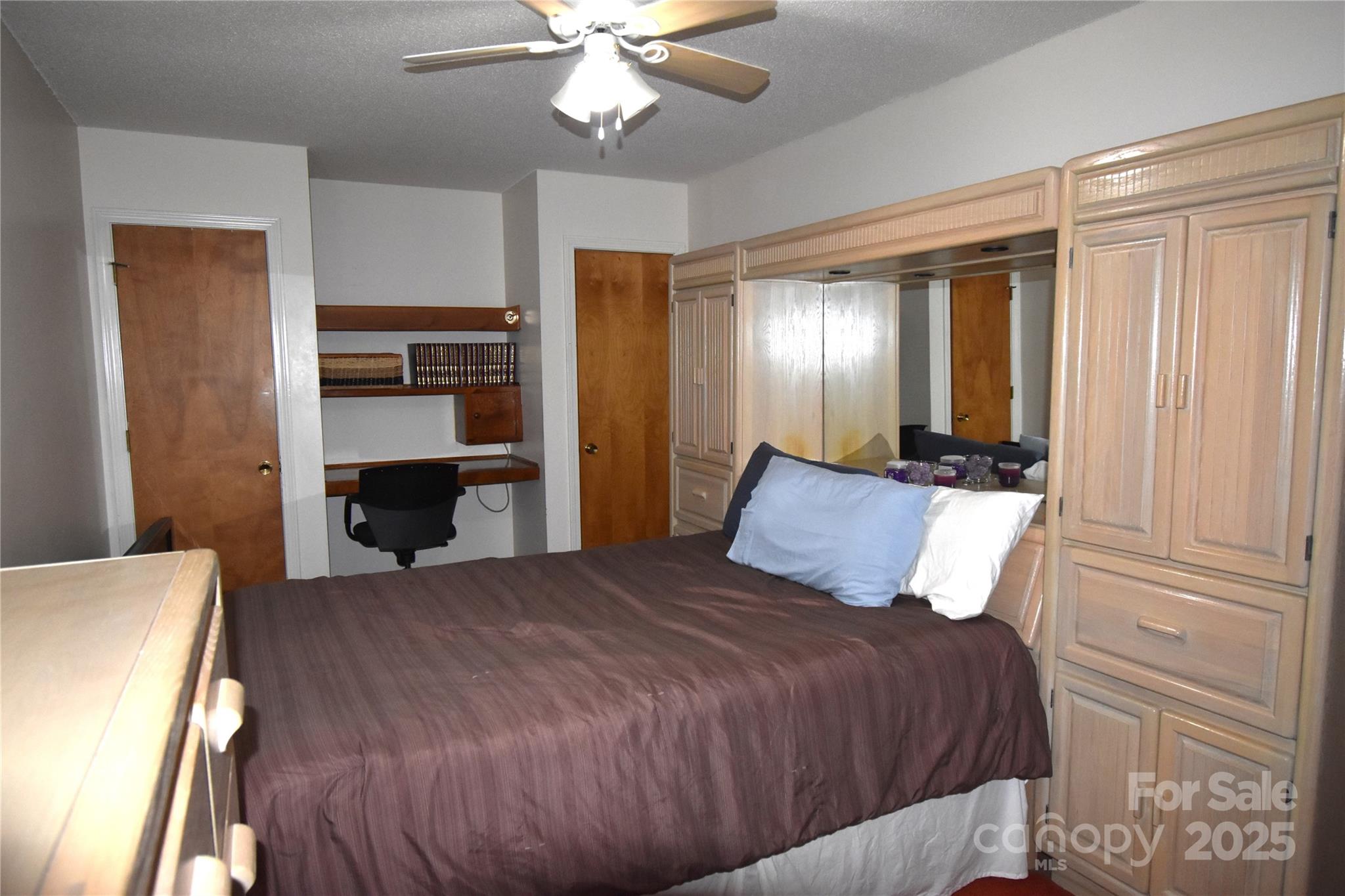 5769 Birch Street Conover, NC 28613 - Photo 20 of 45 a bedroom with a bed and a chandelier