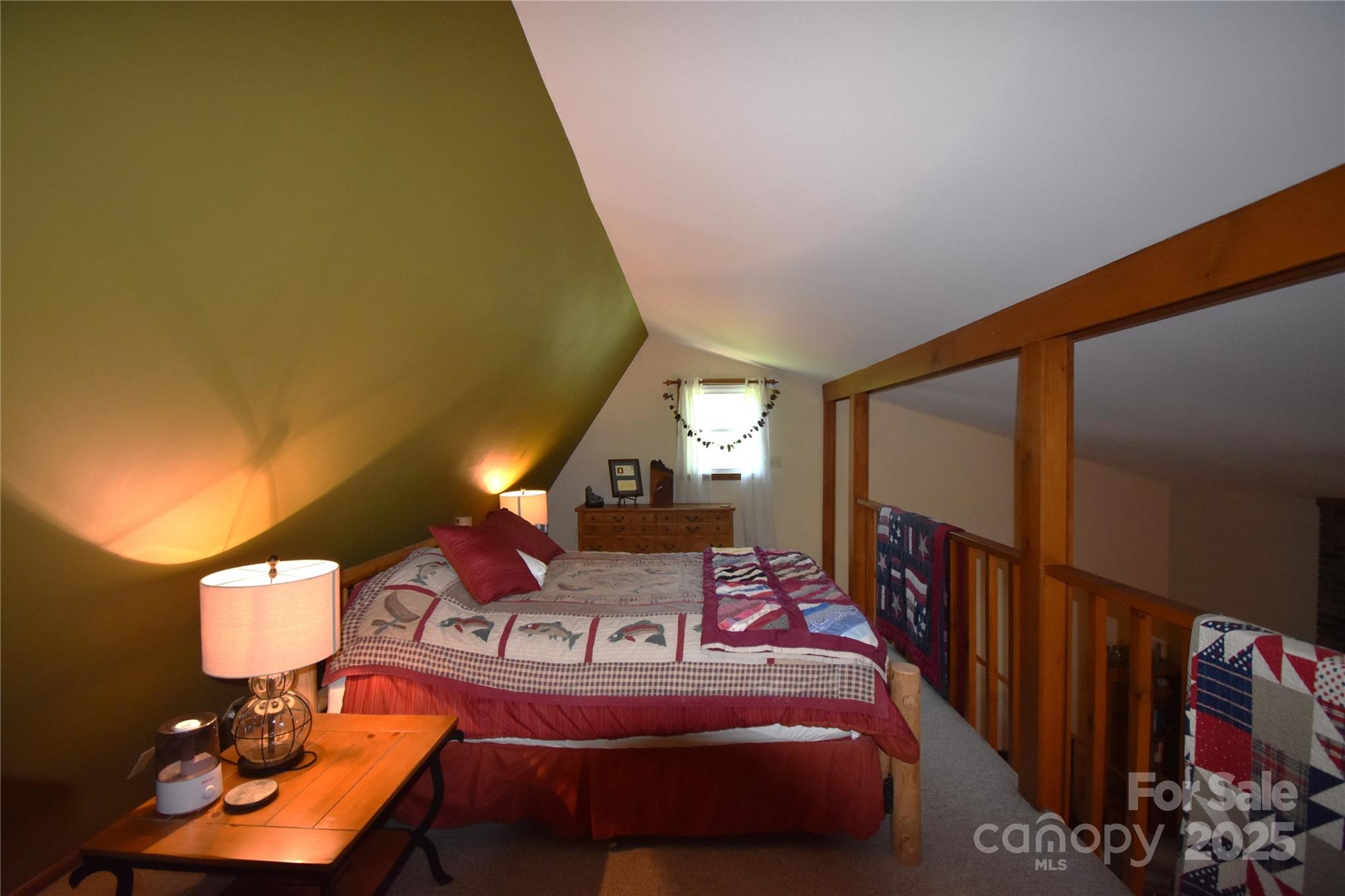 5769 Birch Street Conover, NC 28613 - Photo 23 of 45 a bedroom with bed and a chandelier