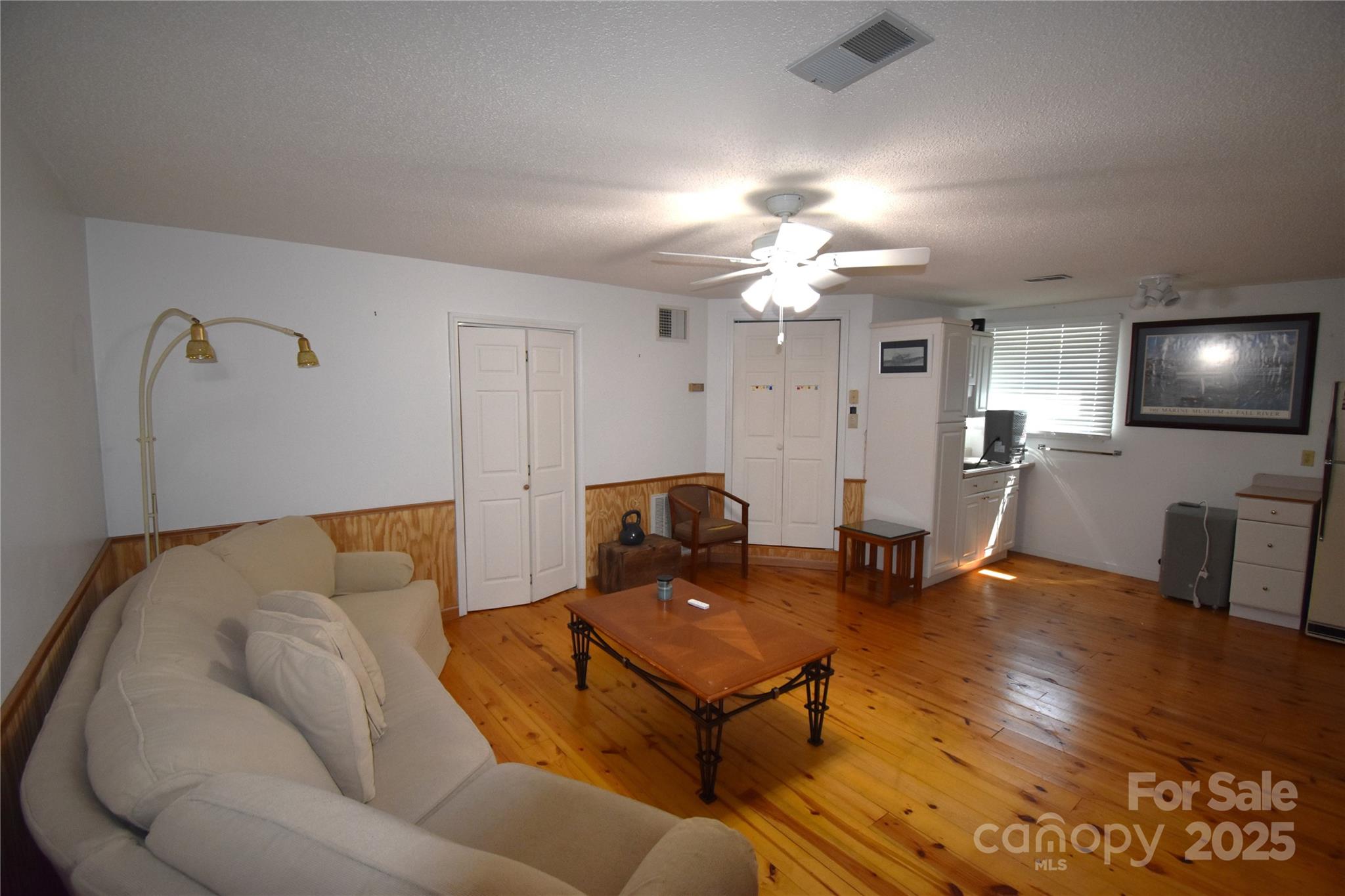 5769 Birch Street Conover, NC 28613 - Photo 27 of 45 a living room with furniture and a chandelier
