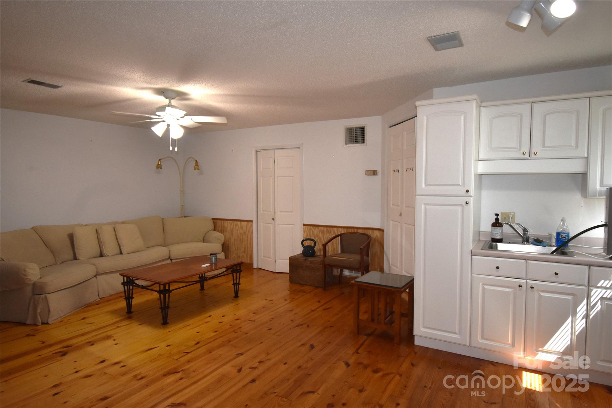 5769 Birch Street Conover, NC 28613 - Photo 30 of 45 a living room with furniture and a chandelier