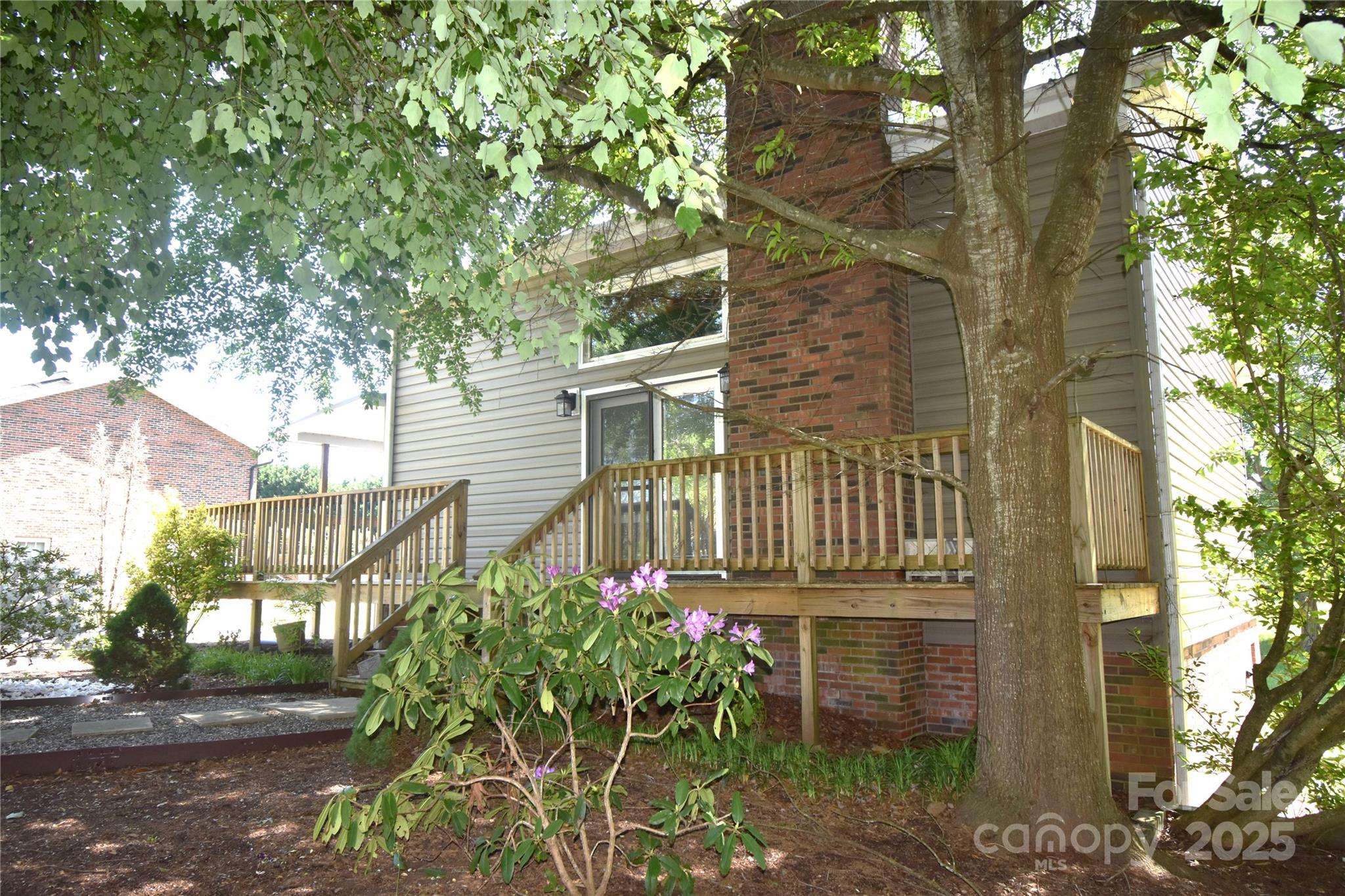5769 Birch Street Conover, NC 28613 - Photo 4 of 45 a yellow house with trees in front of it