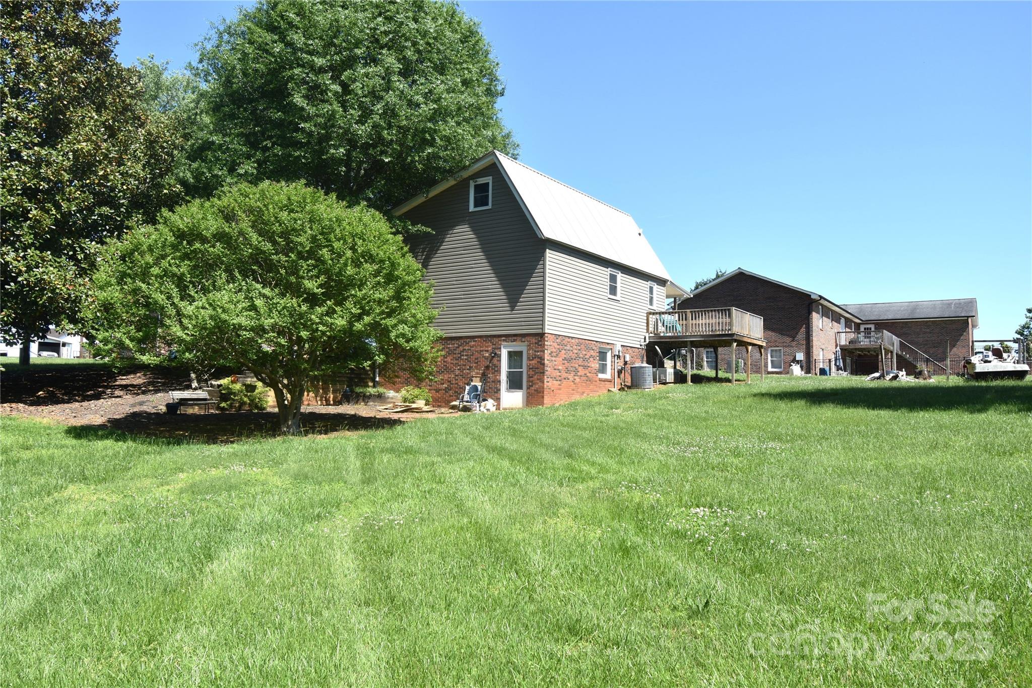 5769 Birch Street Conover, NC 28613 - Photo 6 of 45 a view of a house with a big yard and large trees