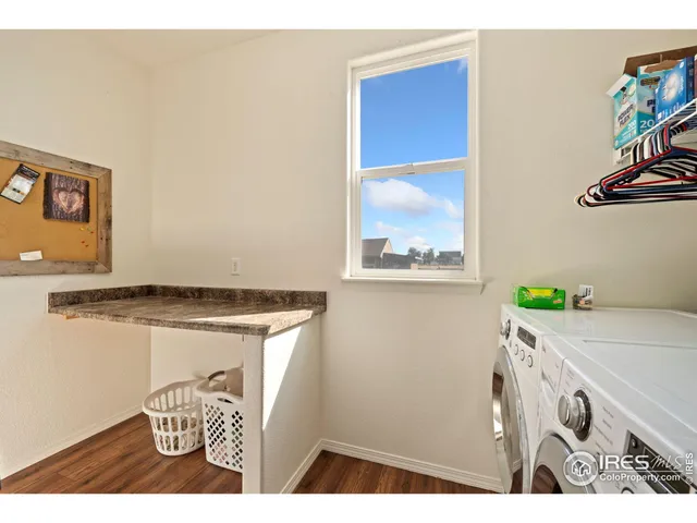 a room with a wooden floor and a table