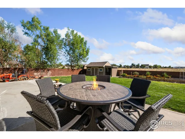 a view of a chairs and table in the patio