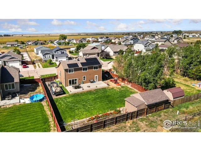 an aerial view of a house with a garden