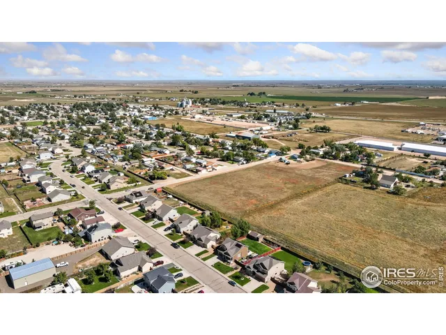 an aerial view of residential building and ocean