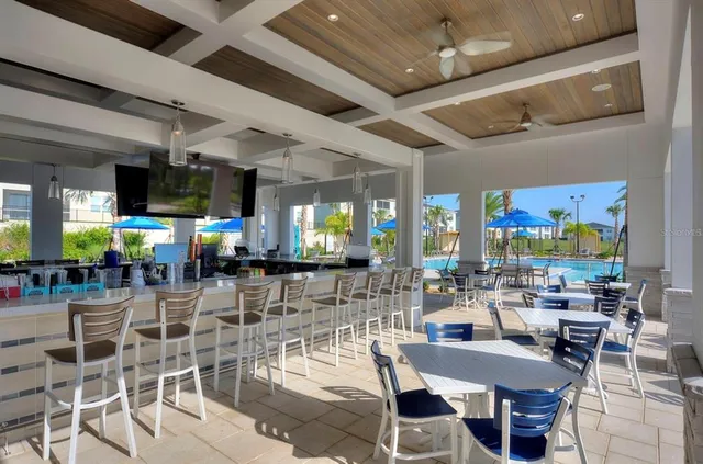 a room with lots of furniture and a large window