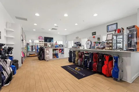 a living room with lots of furniture and clutter