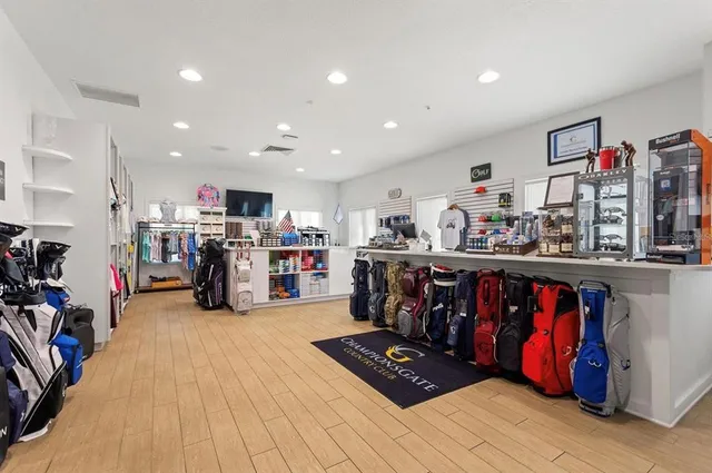 a living room with lots of furniture and clutter