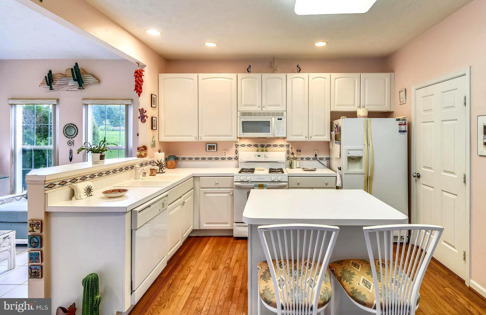 1401 Bretton View Road Annapolis, MD 21409 - Photo 20 of 52 Crisp White Kitchen with Cutout into Sunroom