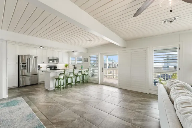 a view of a kitchen with furniture and window