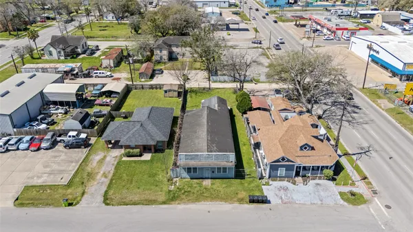 an aerial view of a house with a swimming pool