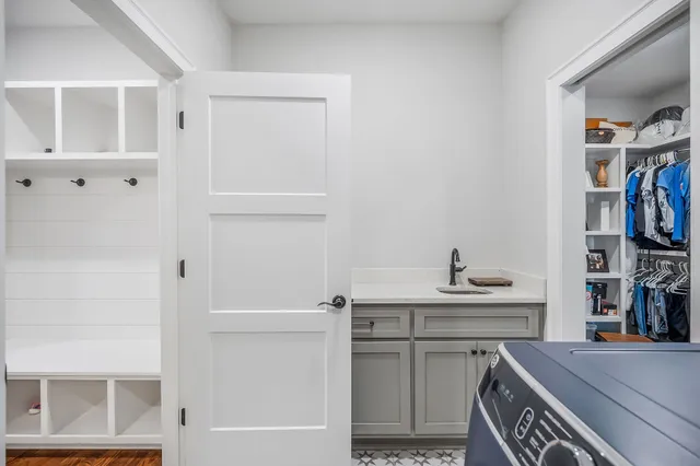 a bathroom with a granite countertop toilet sink and mirror