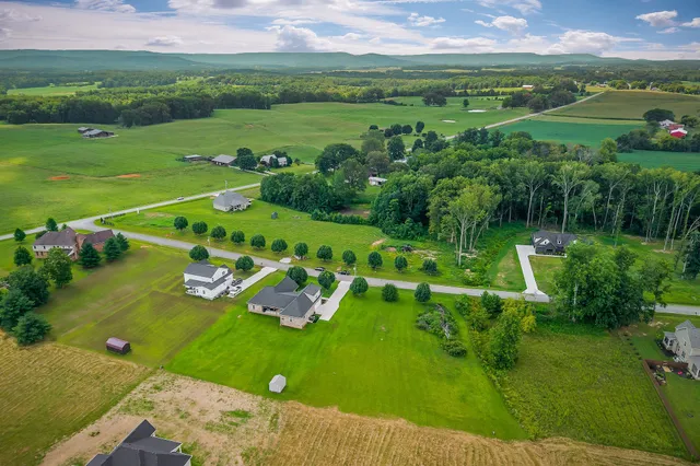 a view of a lake and houses with outdoor space
