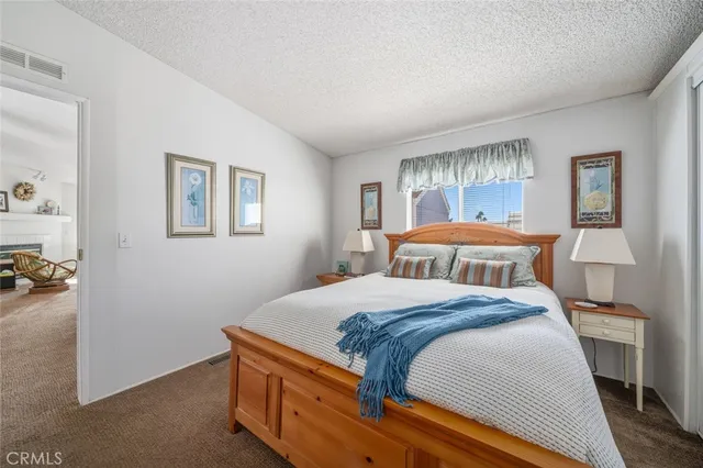 a bedroom with bed and window