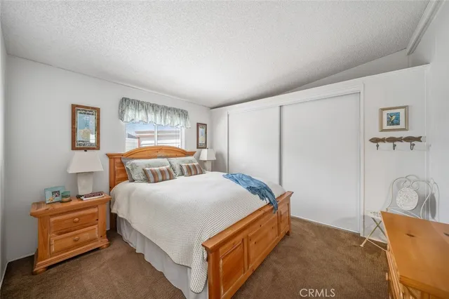 a bedroom with bed and window