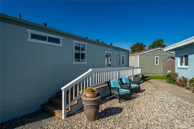 a view of a chair and table in the patio