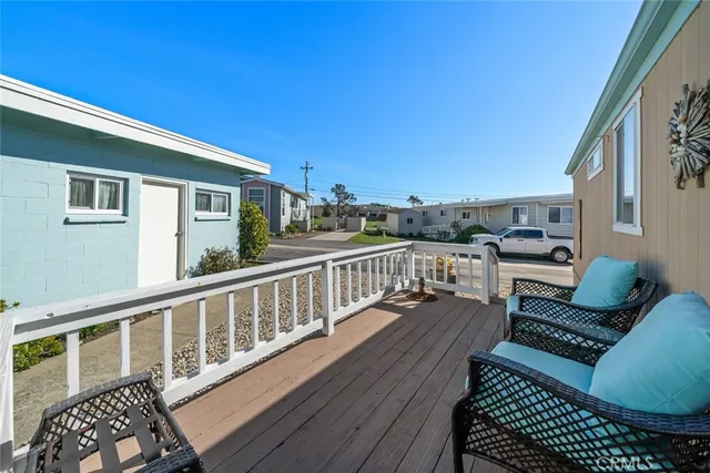 a view of a chairs and table on the wooden floor