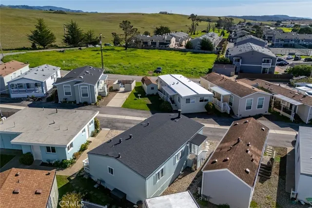 an aerial view of a house with big yard and a big yard