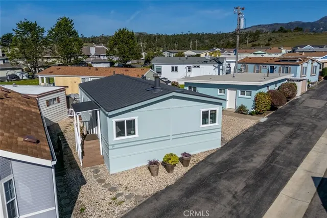 a aerial view of a house with a yard