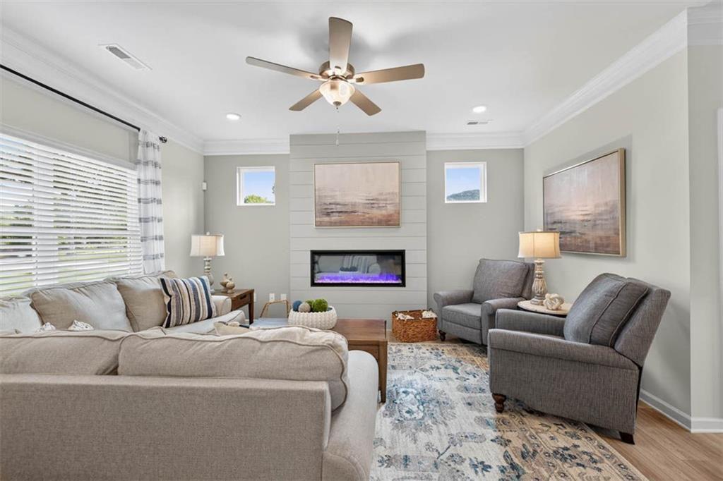 498 Guy Williams Road Rock Spring, GA 30739 - Photo 15 of 42 a living room with furniture and a fireplace