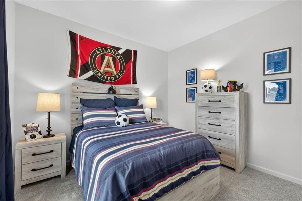 498 Guy Williams Road Rock Spring, GA 30739 - Photo 22 of 42 a bedroom with a bed and closet