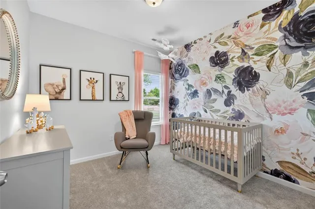 a bedroom with a bed and chair