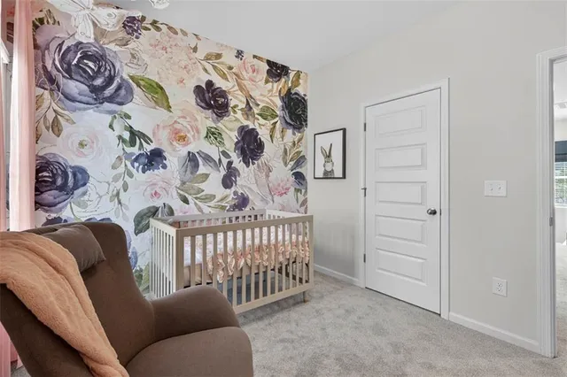 a bedroom with a couch with wooden floor