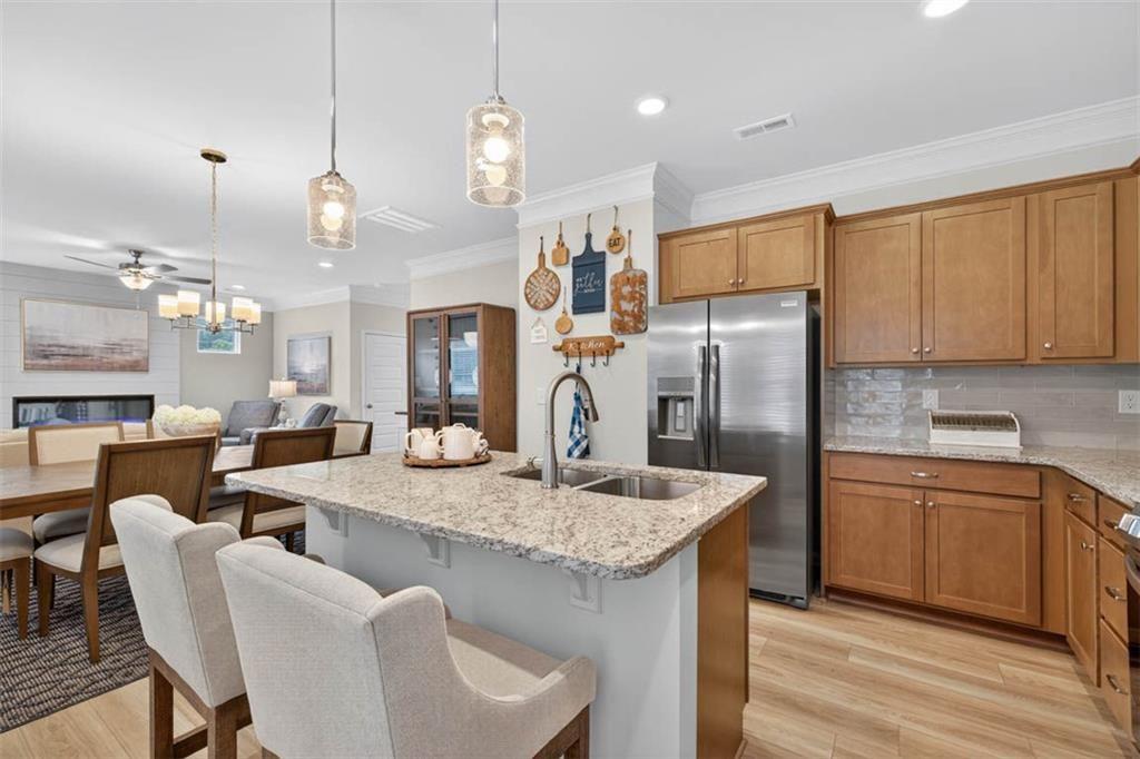 498 Guy Williams Road Rock Spring, GA 30739 - Photo 9 of 42 a kitchen with stainless steel appliances granite countertop a kitchen island a stove a table and chairs