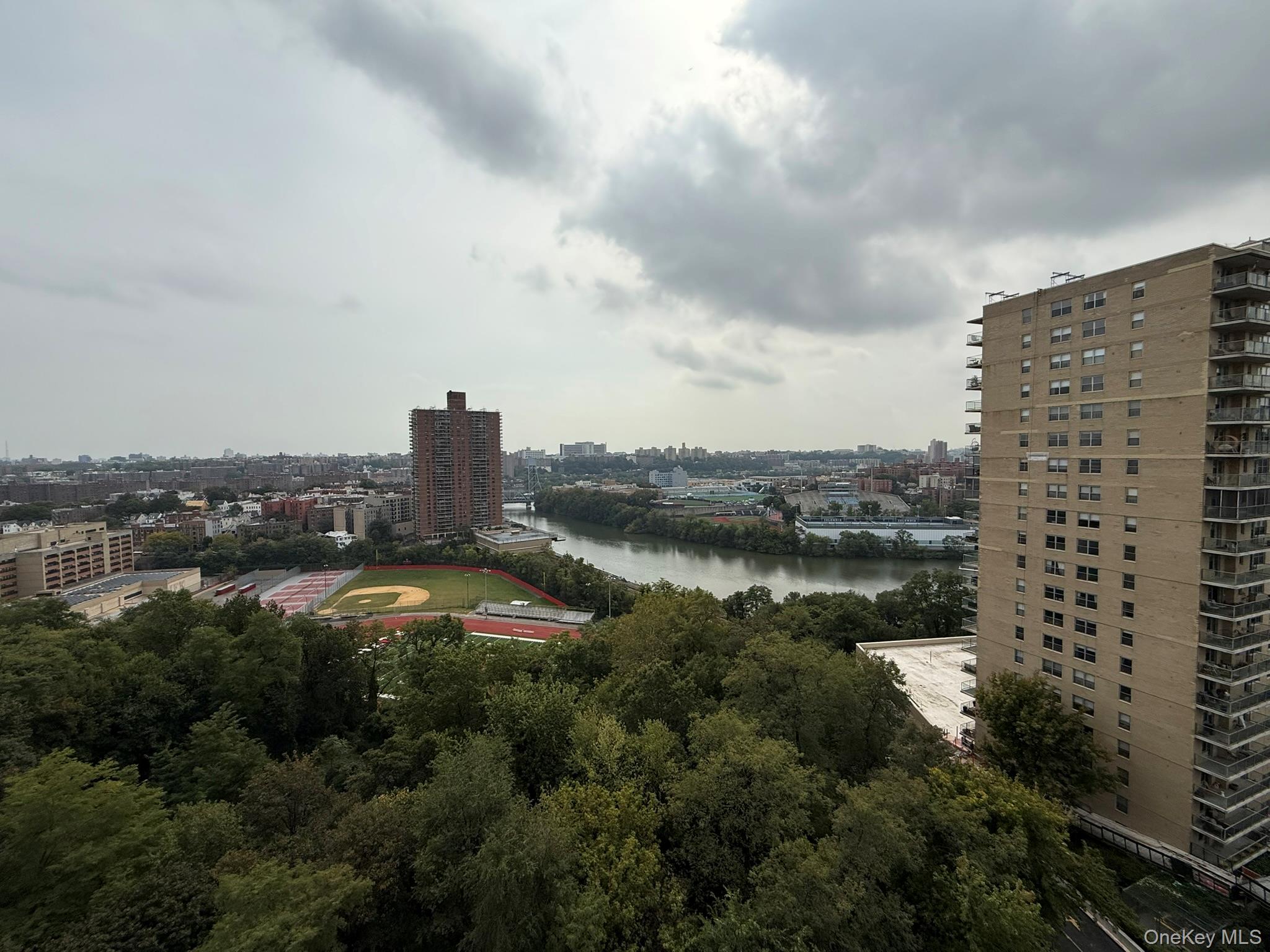 555 Kappock Street, Unit 11P Bronx, NY 10463 - Photo 8 of 15 a view of a lake with a city skyline in the background