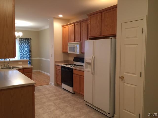 4224 Creek Road Allentown, PA 18104 - Photo 7 of 19 a kitchen with stainless steel appliances granite countertop a refrigerator and a stove top oven