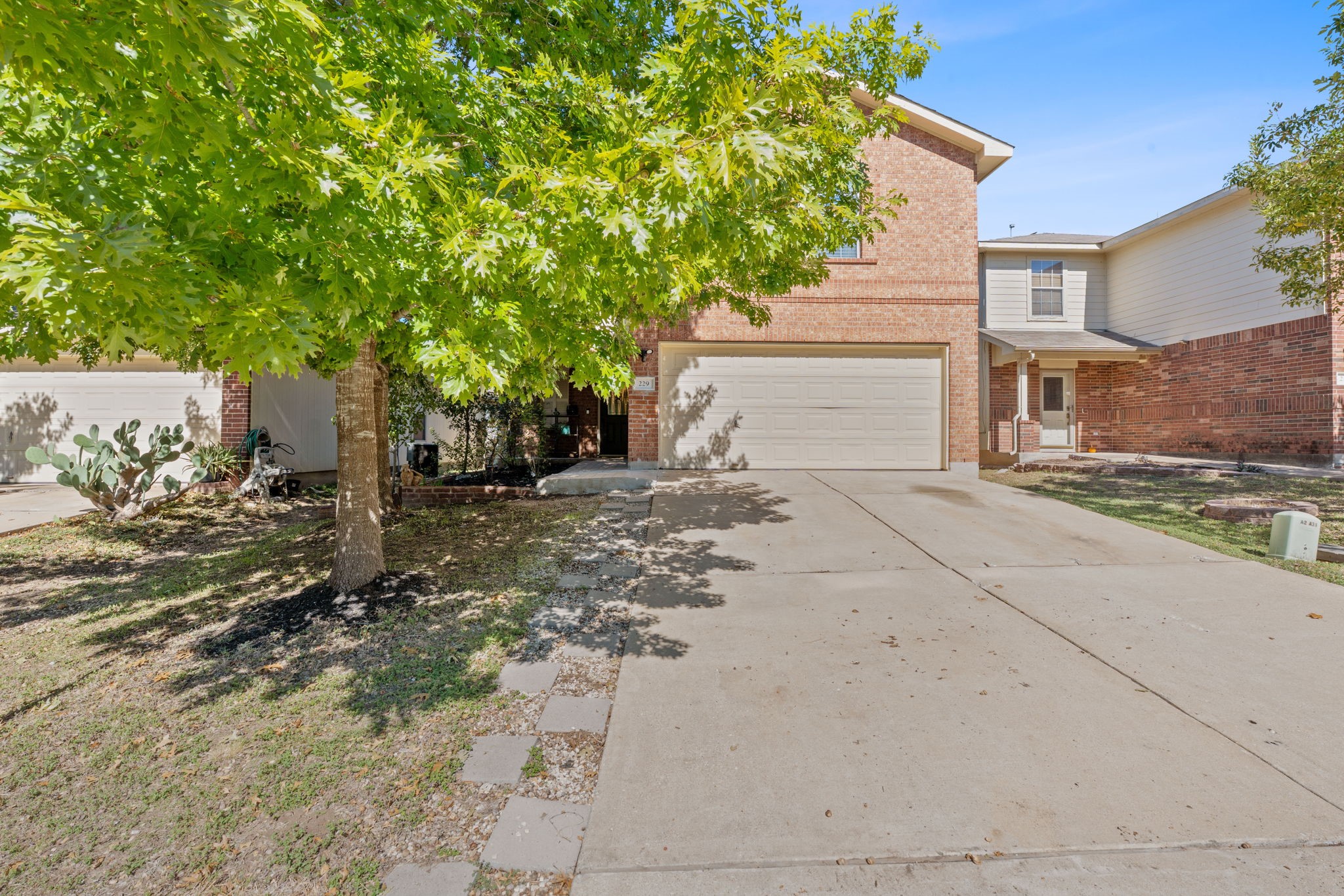 229 Black Forest Road Buda, TX 78610 - Photo 2 of 32 a backyard of a house with lots of green space