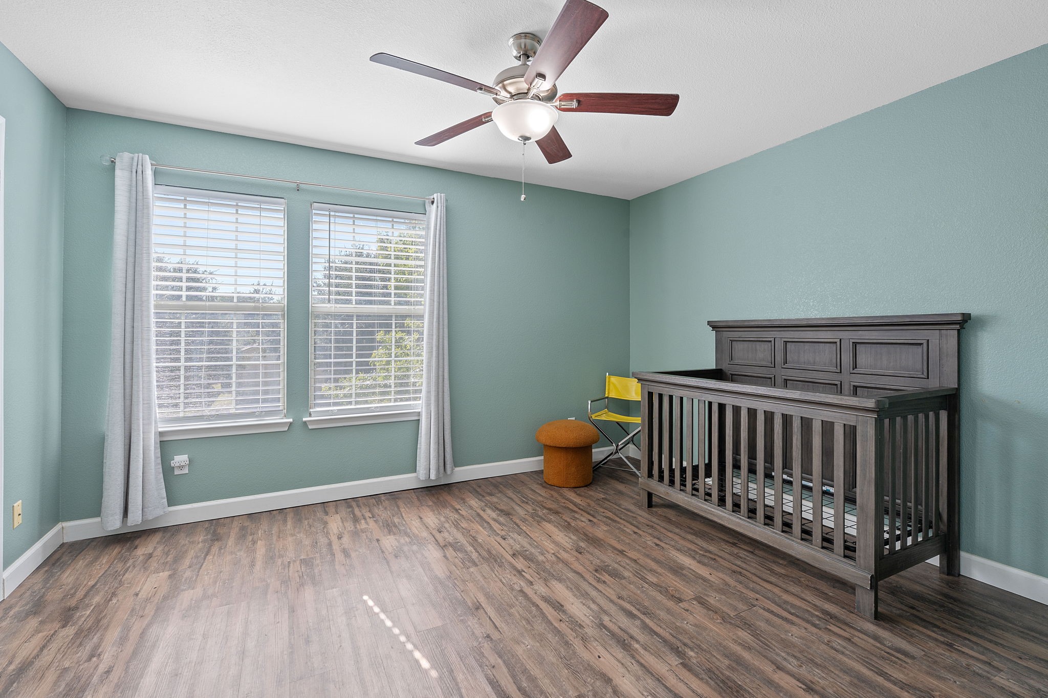 229 Black Forest Road Buda, TX 78610 - Photo 24 of 32 a bedroom with furniture and windows
