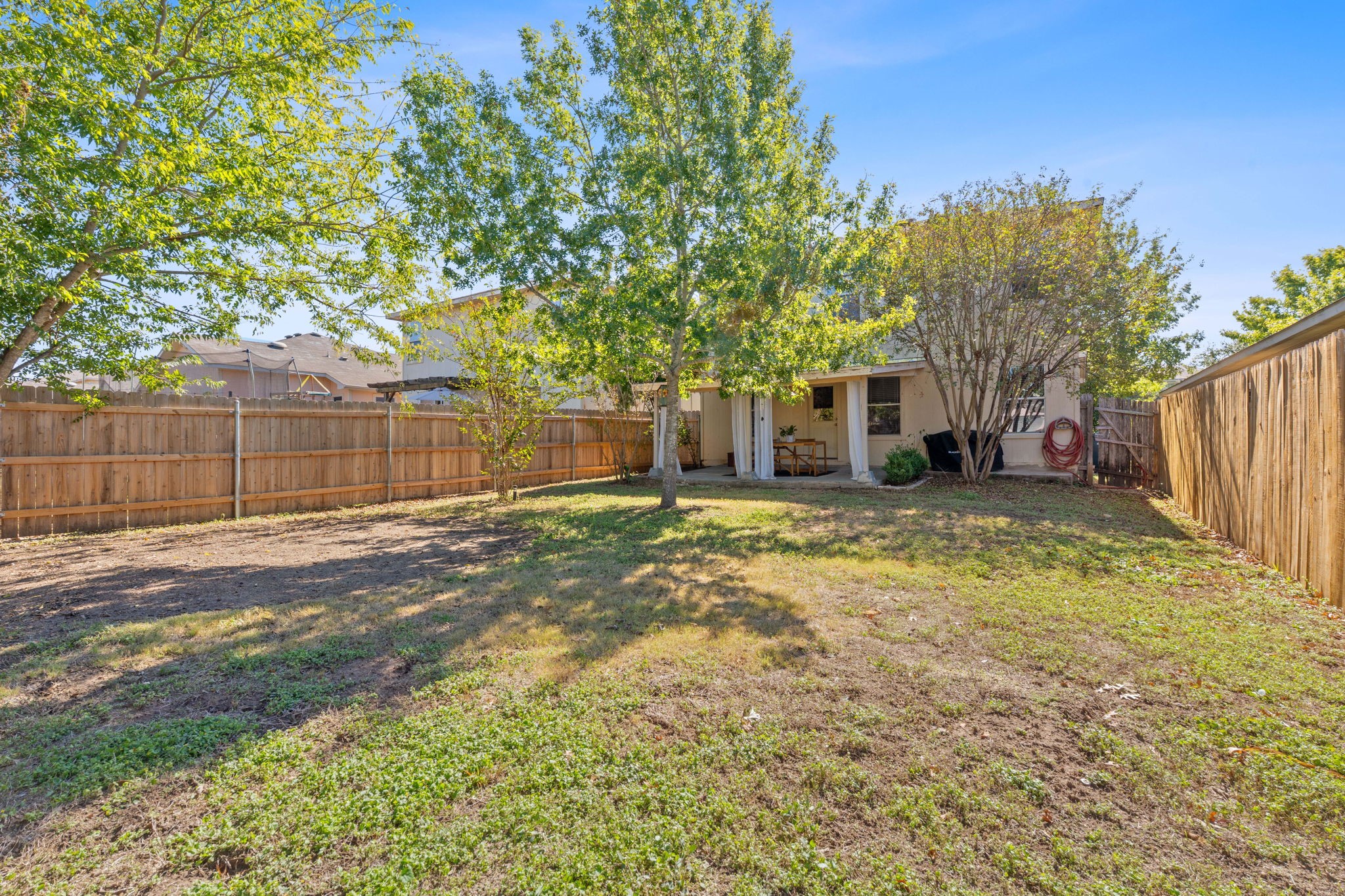 229 Black Forest Road Buda, TX 78610 - Photo 31 of 32 a view of a house with a yard