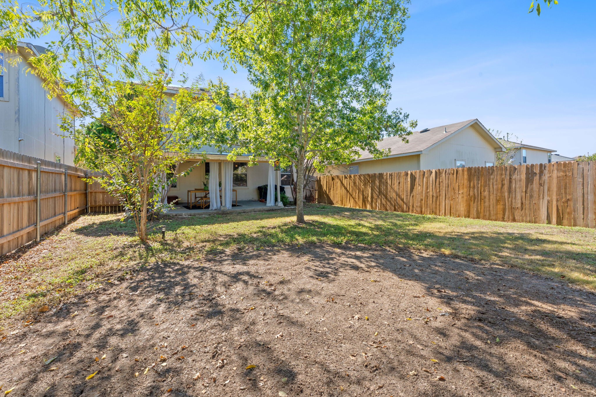 229 Black Forest Road Buda, TX 78610 - Photo 32 of 32 a house with trees in the background