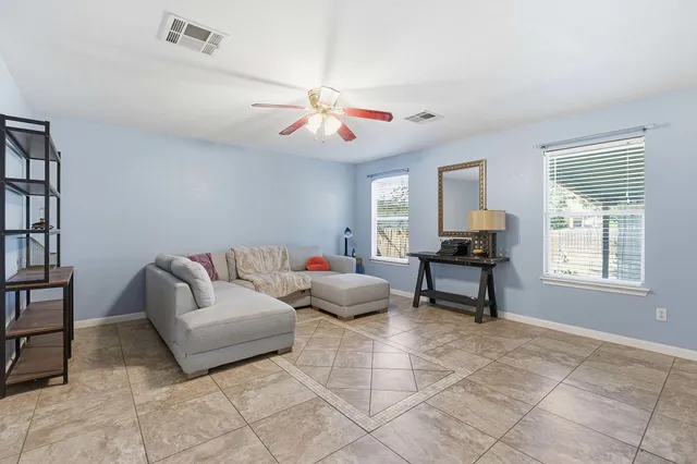 a living room with furniture and a window
