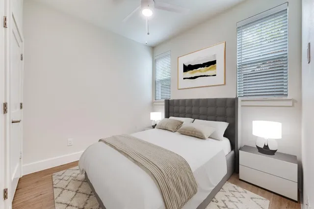 a kitchen with stainless steel appliances granite countertop a refrigerator sink and white cabinets