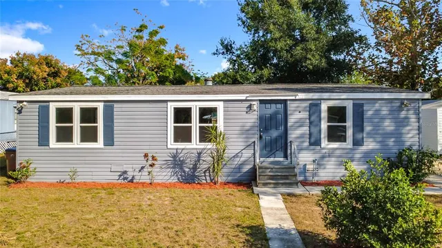 front view of house with a yard