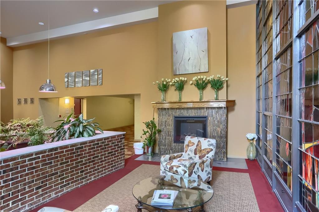5 Bayard Road, Unit 503 Pittsburgh, PA 15213 - Photo 6 of 42 a living room with furniture and a fireplace