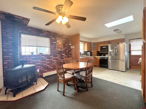 a dining room with furniture and window