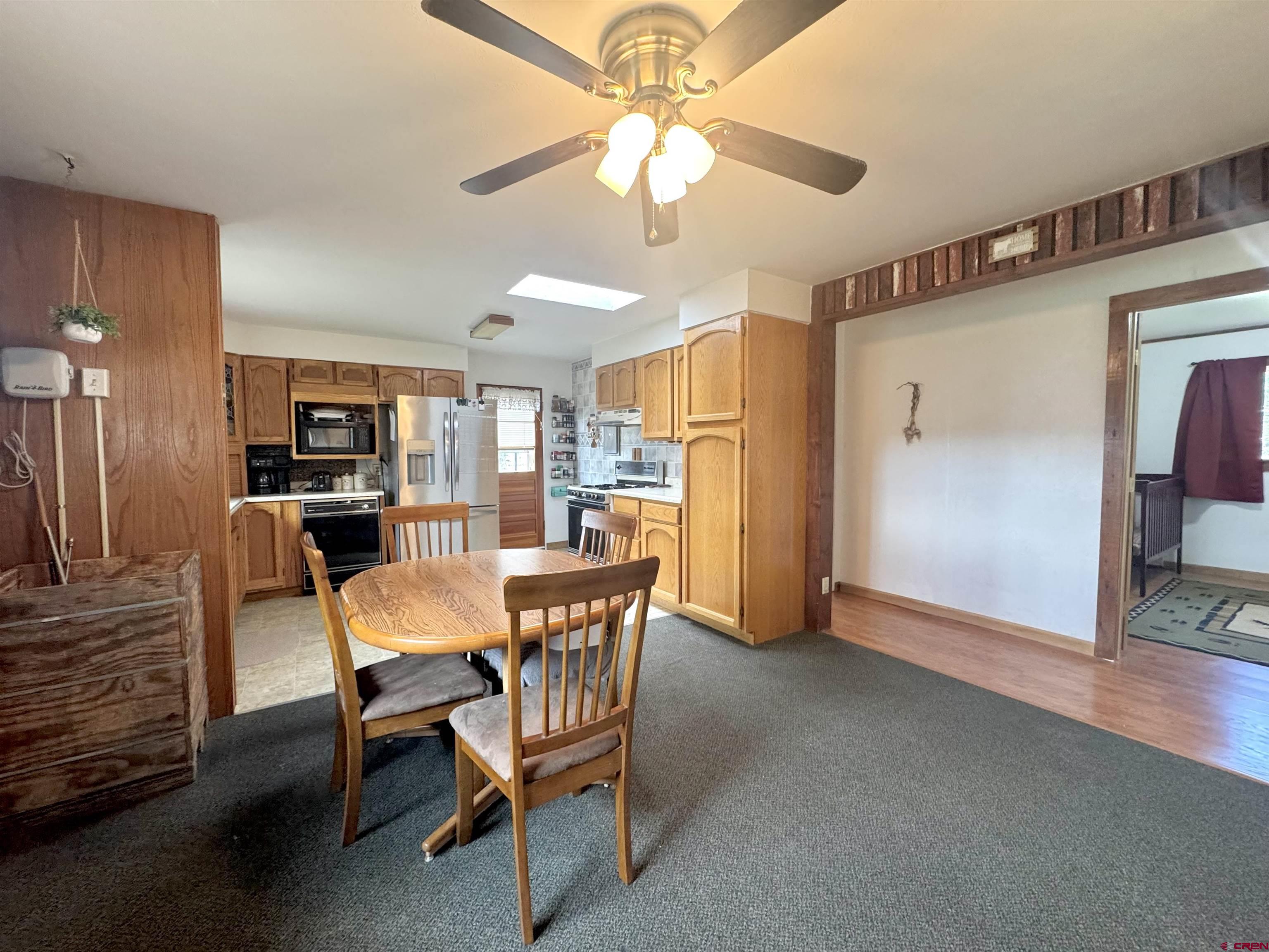 113 Conejos Street Romeo, CO 81148 - Photo 19 of 36 a dining room with furniture and window