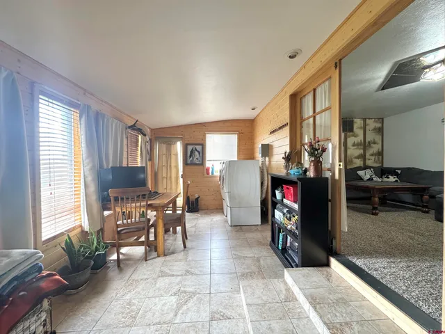 a view of a livingroom with furniture and a fireplace