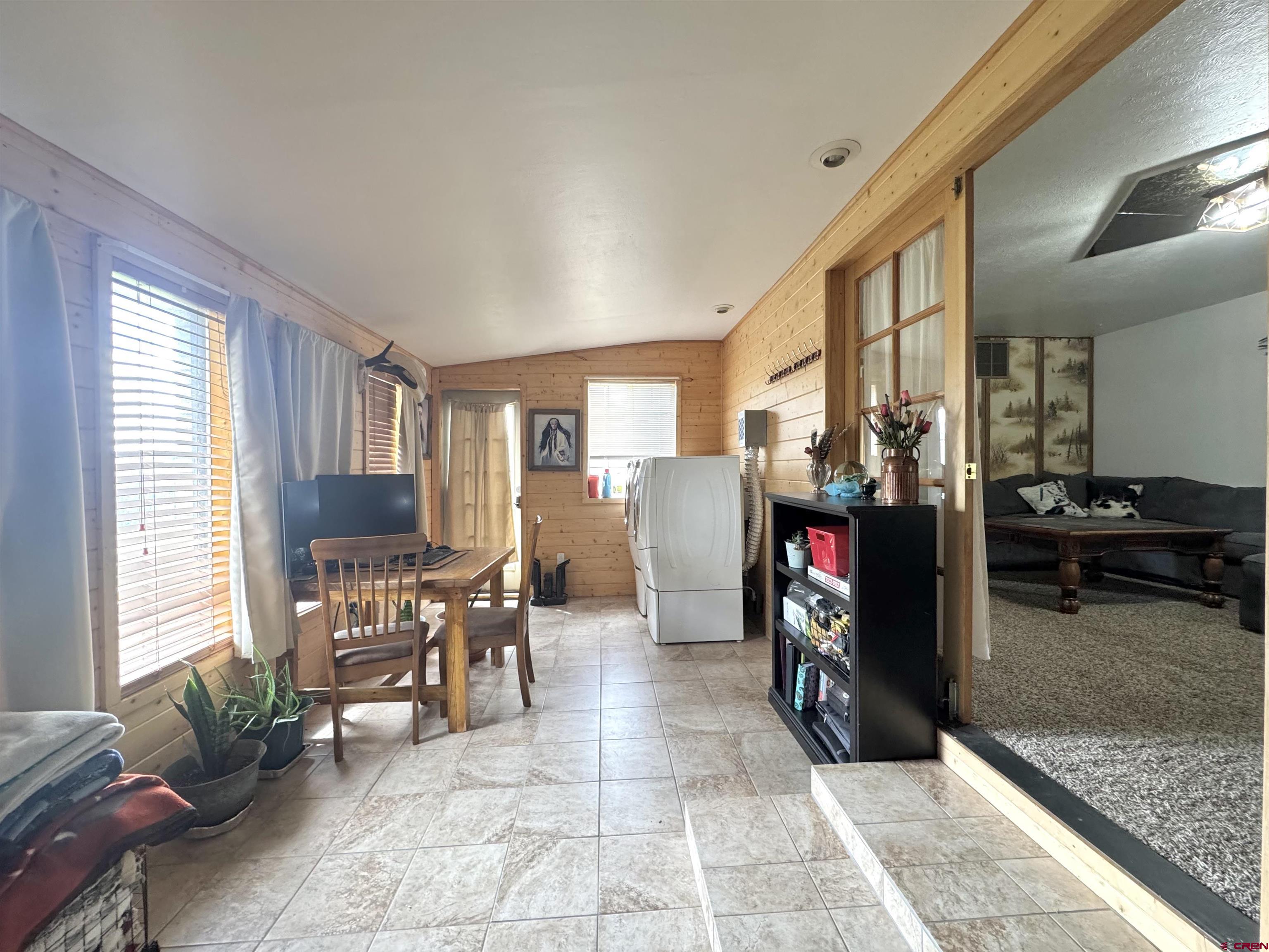 113 Conejos Street Romeo, CO 81148 - Photo 32 of 36 a view of a livingroom with furniture and a fireplace