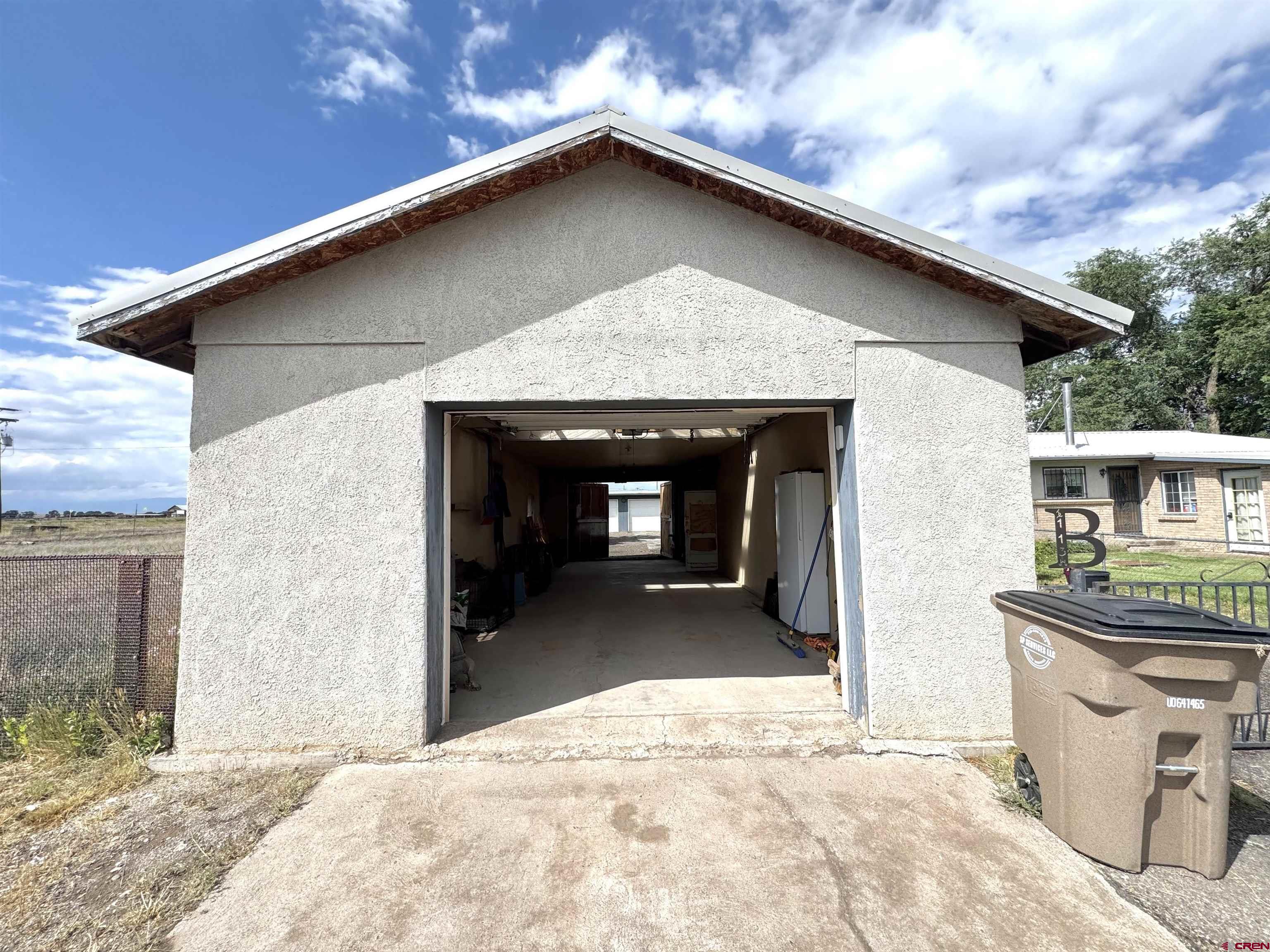 113 Conejos Street Romeo, CO 81148 - Photo 9 of 36 a front view of a house with a yard