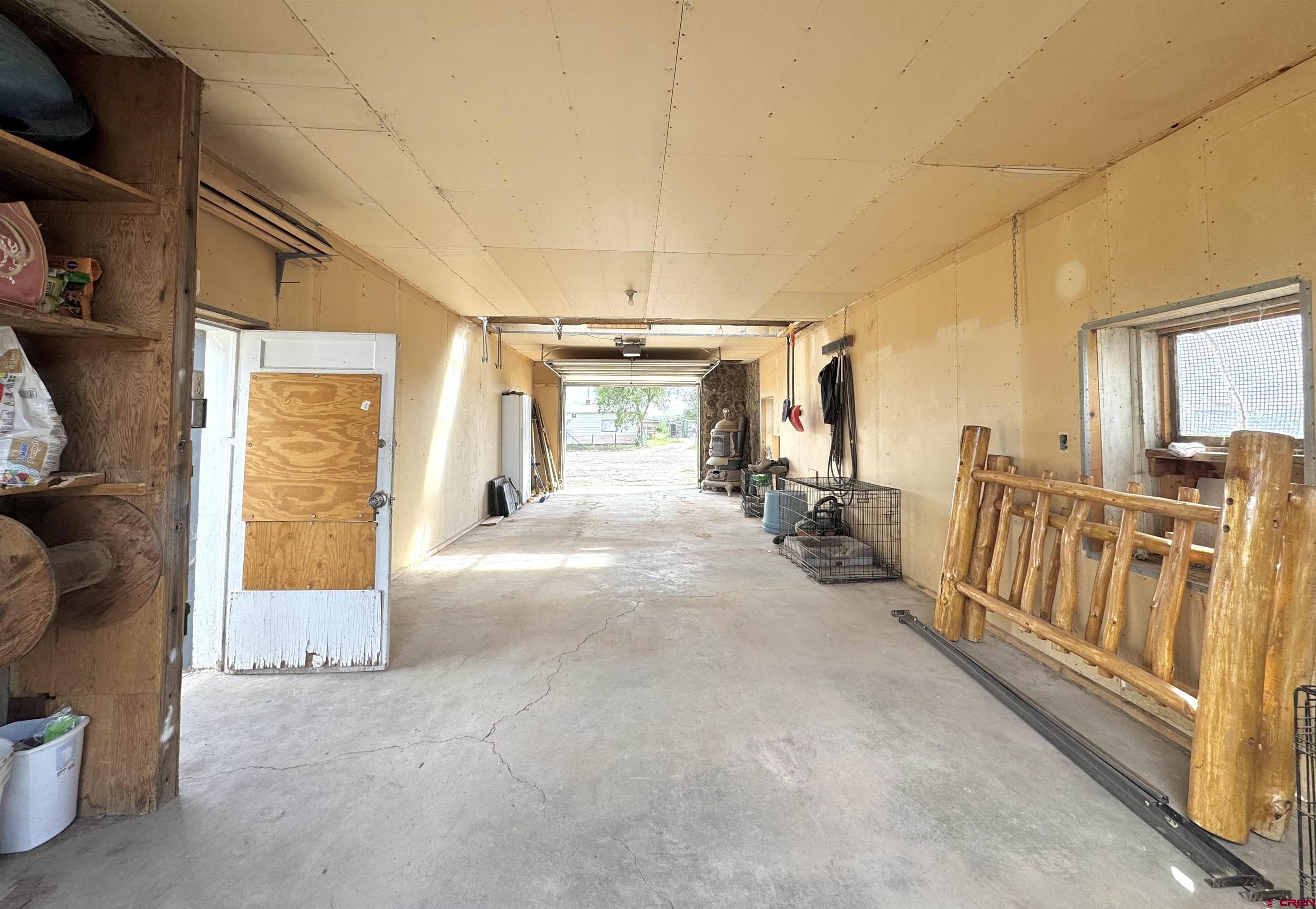113 Conejos Street Romeo, CO 81148 - Photo 10 of 36 a view of an entryway with wooden floor