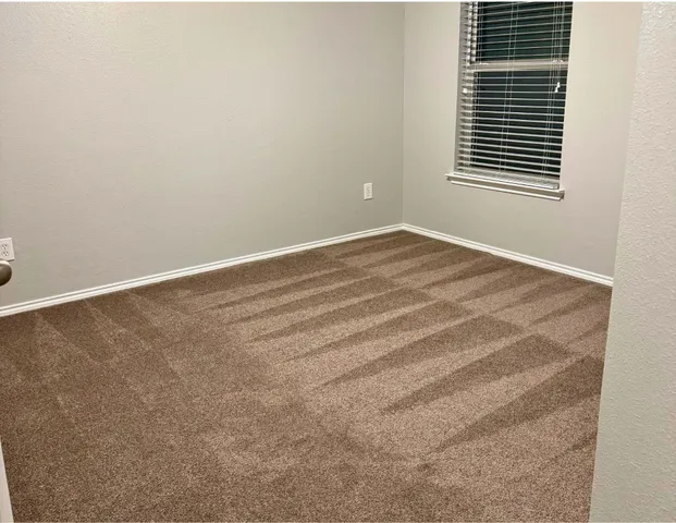 a view of a room that has a window