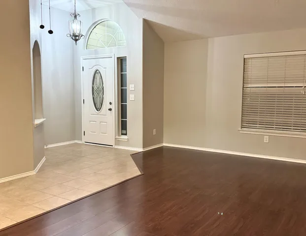 a view of a livingroom with washer and dryer