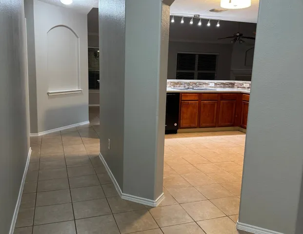 a hallway with washer and dryer