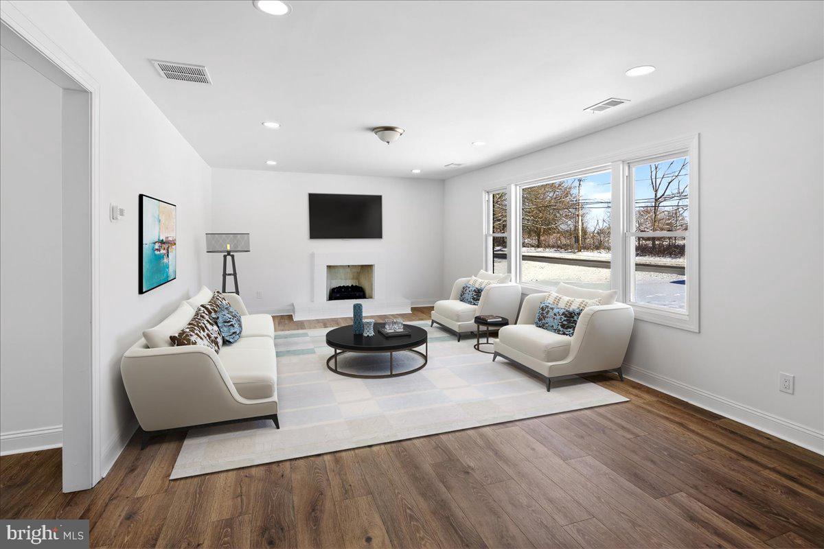 464 Sykesville Road Wrightstown, NJ 08562 - Photo 2 of 32 a living room with furniture and a flat screen tv